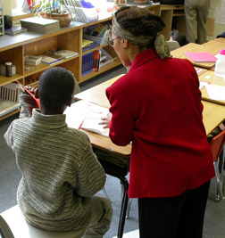Teacher working with a boy